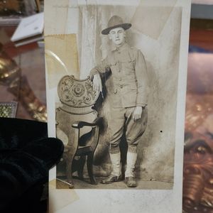 Man Leaning on Chair Photograph